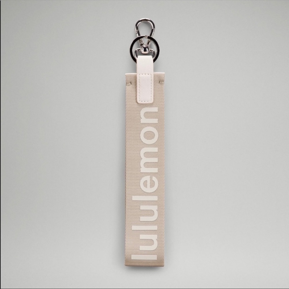 Lululemon never lost keychain in white opal